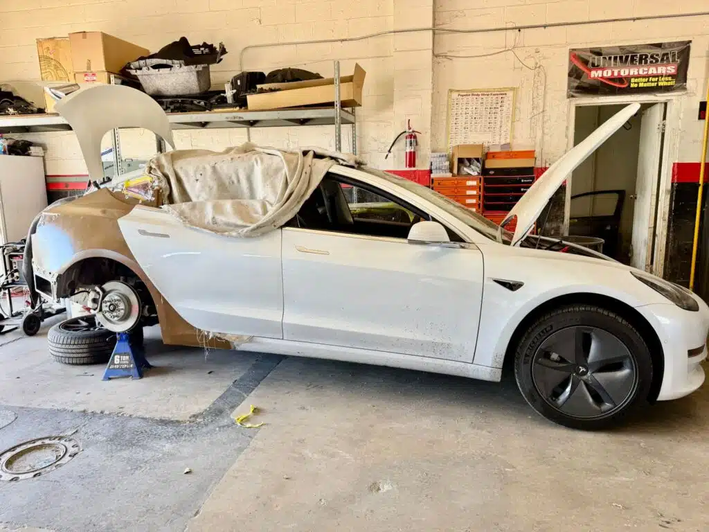 white tesla accident repair