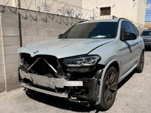 BMW collision repair with front bumper removed at Universal Motorcars auto body shop in Las Vegas