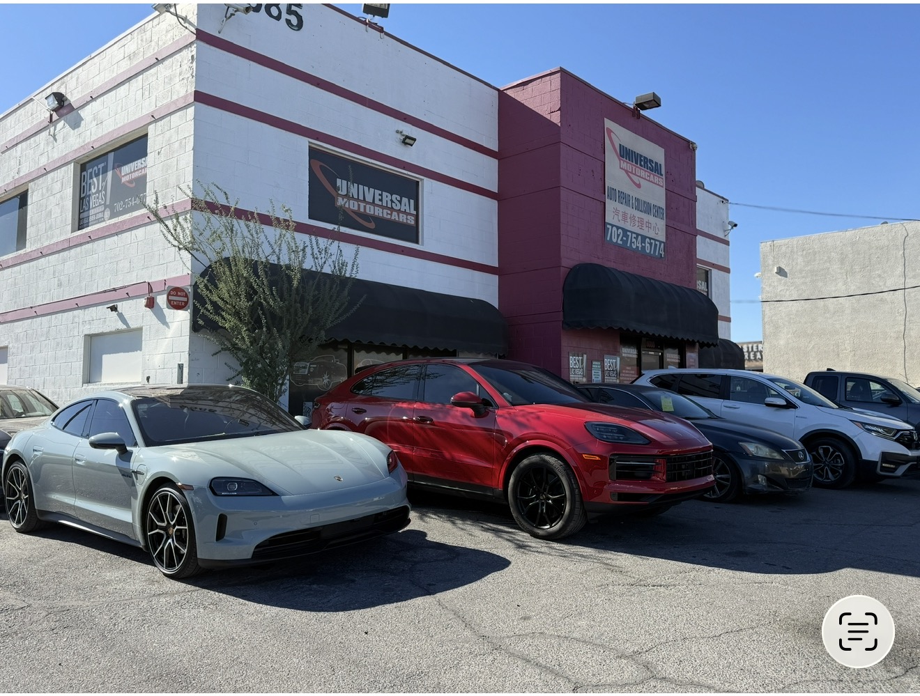 Universal Motorcars Las Vegas collision repair shop with Porsche vehicles at the Spring Mountain location