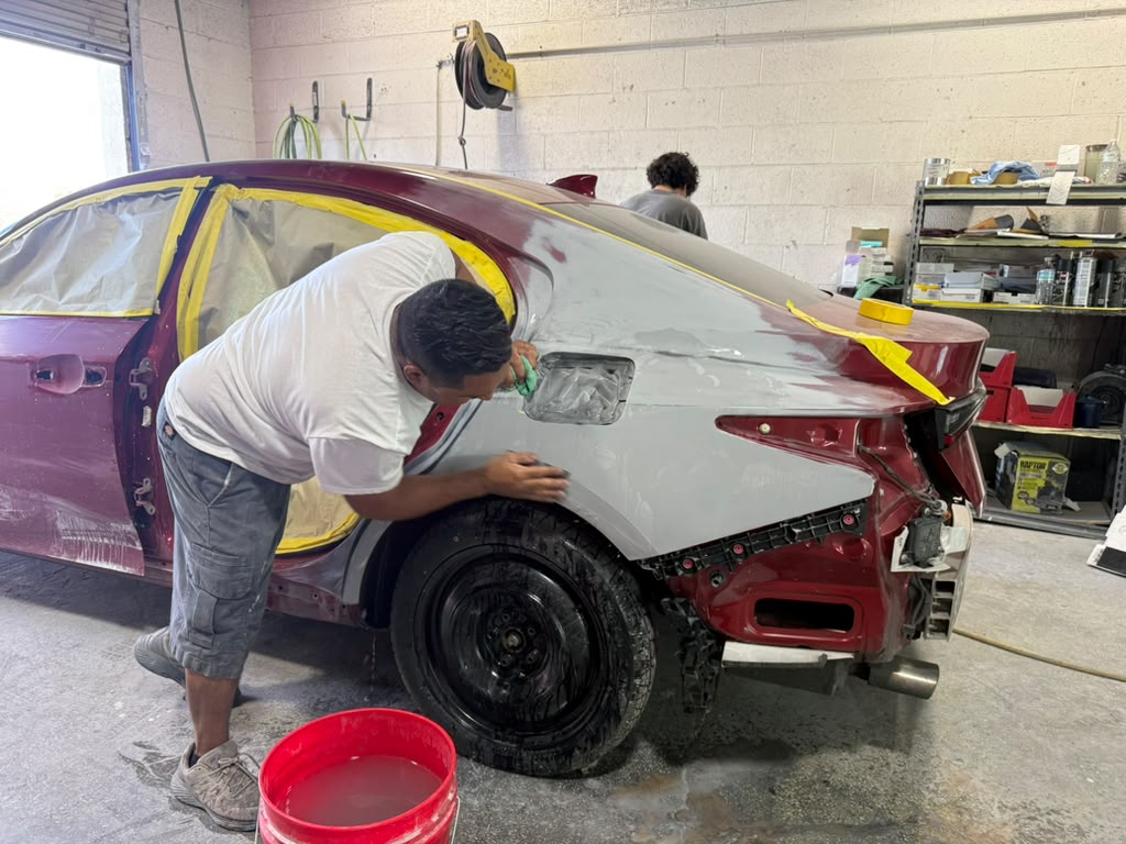 Auto body paint preparation and refinishing at Universal Motorcars collision repair shop in Las Vegas