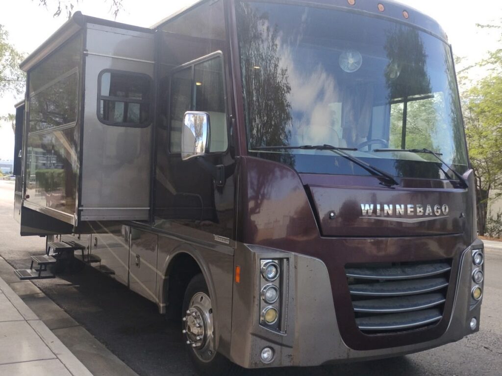 Front corner and multi-tone exterior of a Winnebago motorhome