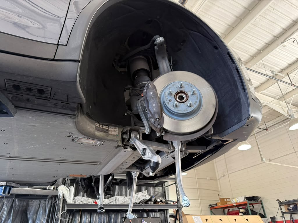 Tesla brake rotor, caliper and front suspension repair at Universal Motorcars Las Vegas