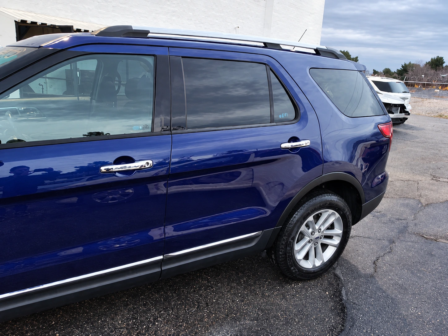 Blue Ford SUV after rear door and quarter-panel repair at Universal Motorcars