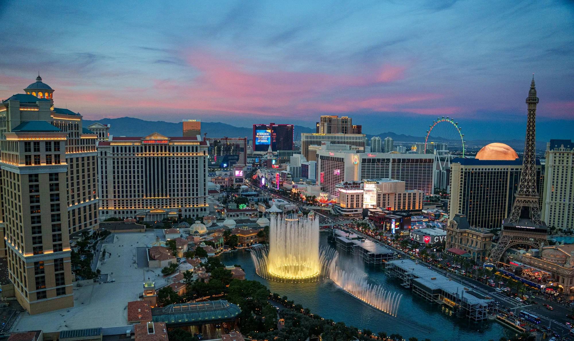 Las Vegas Strip at twilight, with the Bellagio fountains, High Roller and Paris Las Vegas Eiffel Tower