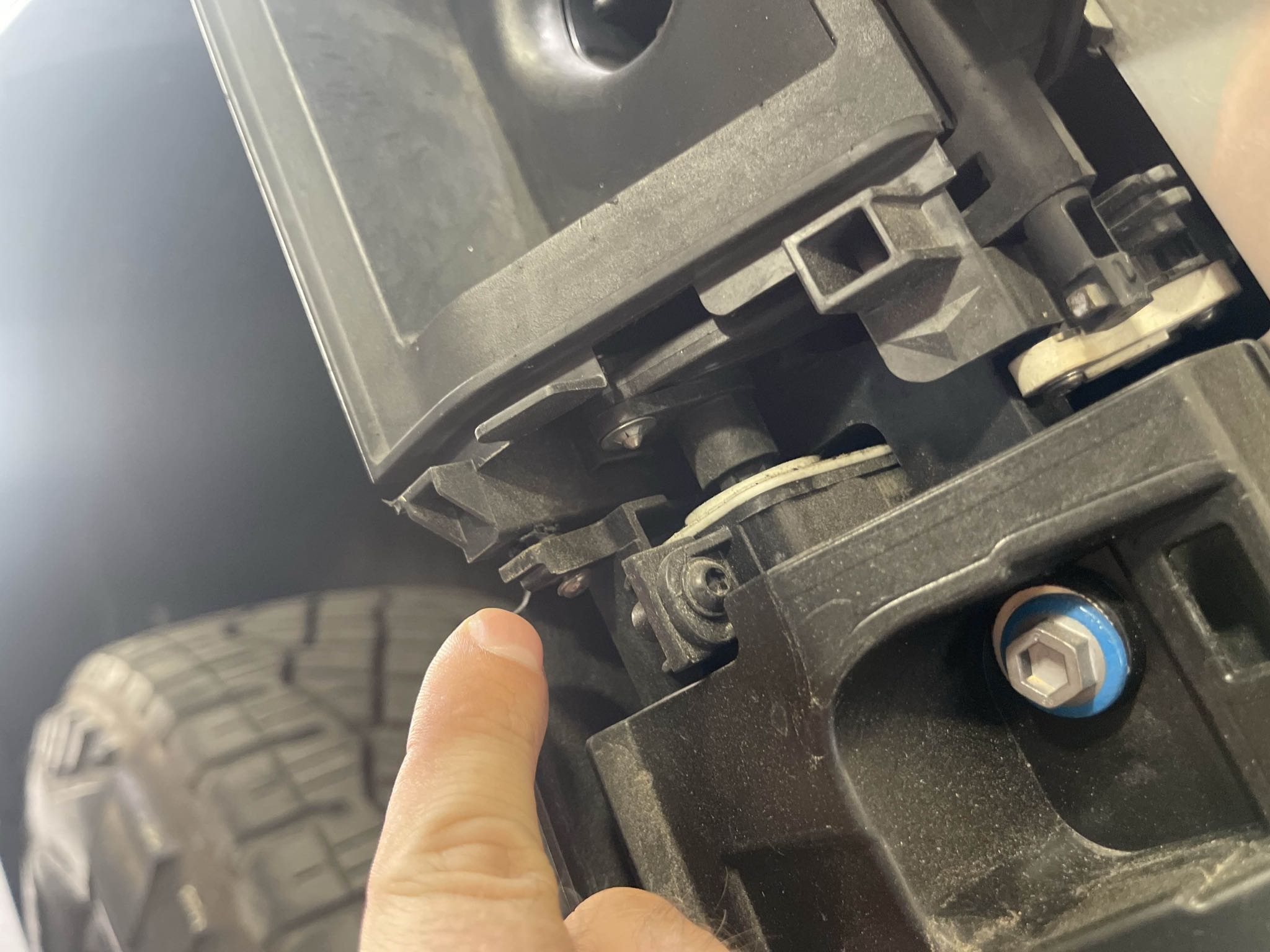 Close-up of a damaged attachment area beneath the Cybertruck rear bodywork