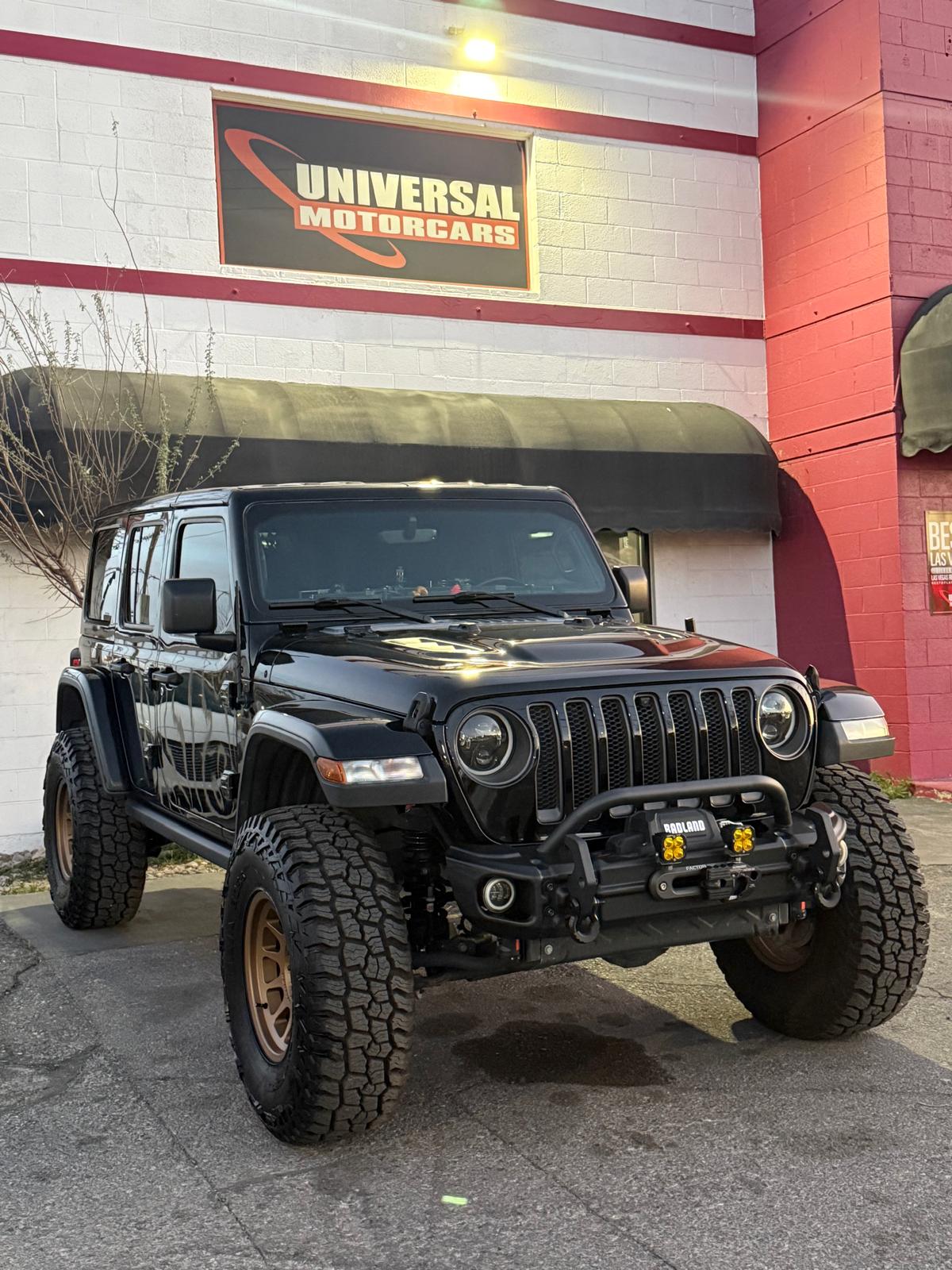 Black Jeep Wrangler outside Universal Motorcars