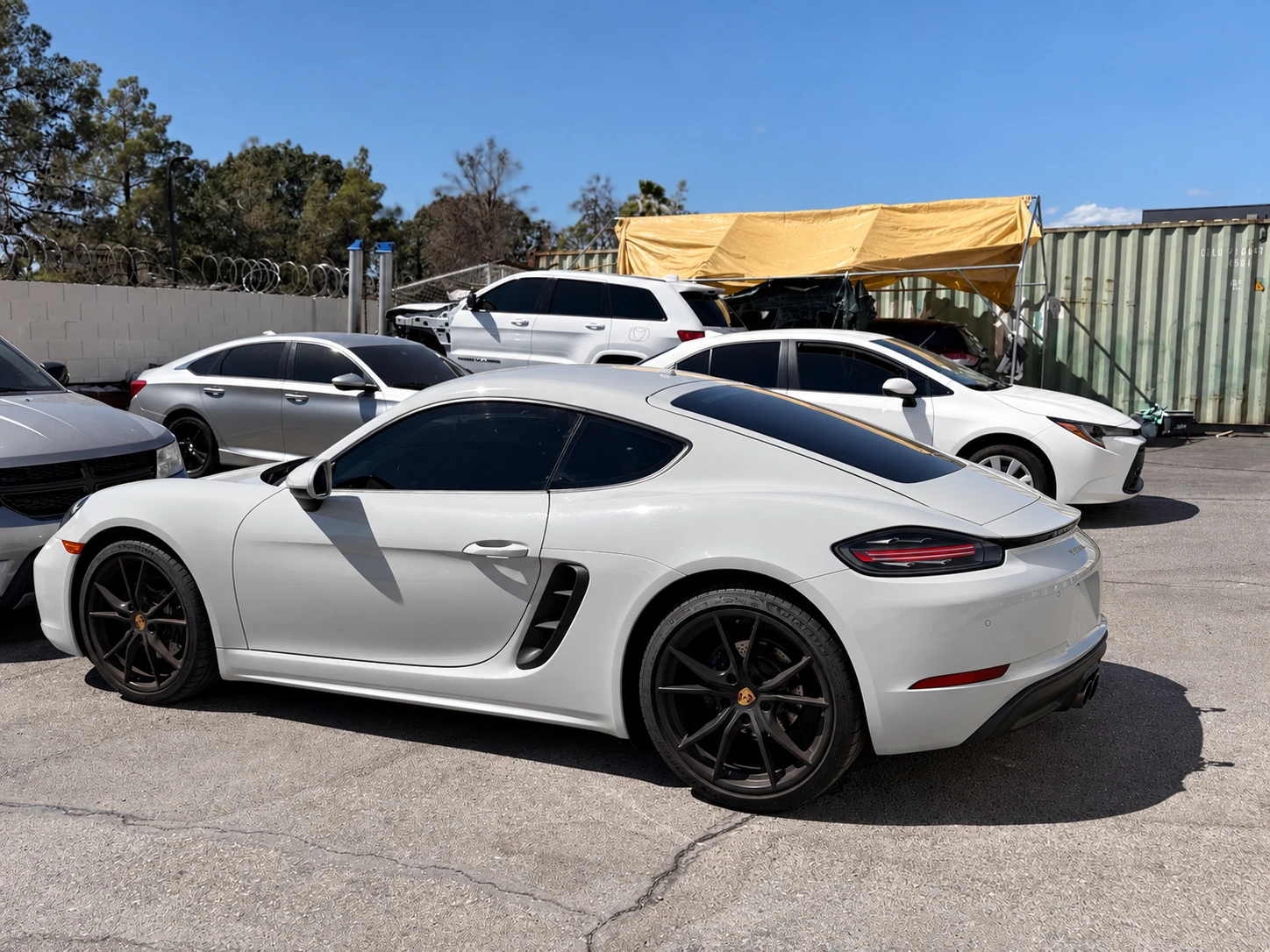 AI-created repair preview of the Porsche Cayman with rear bumper and lamps in place