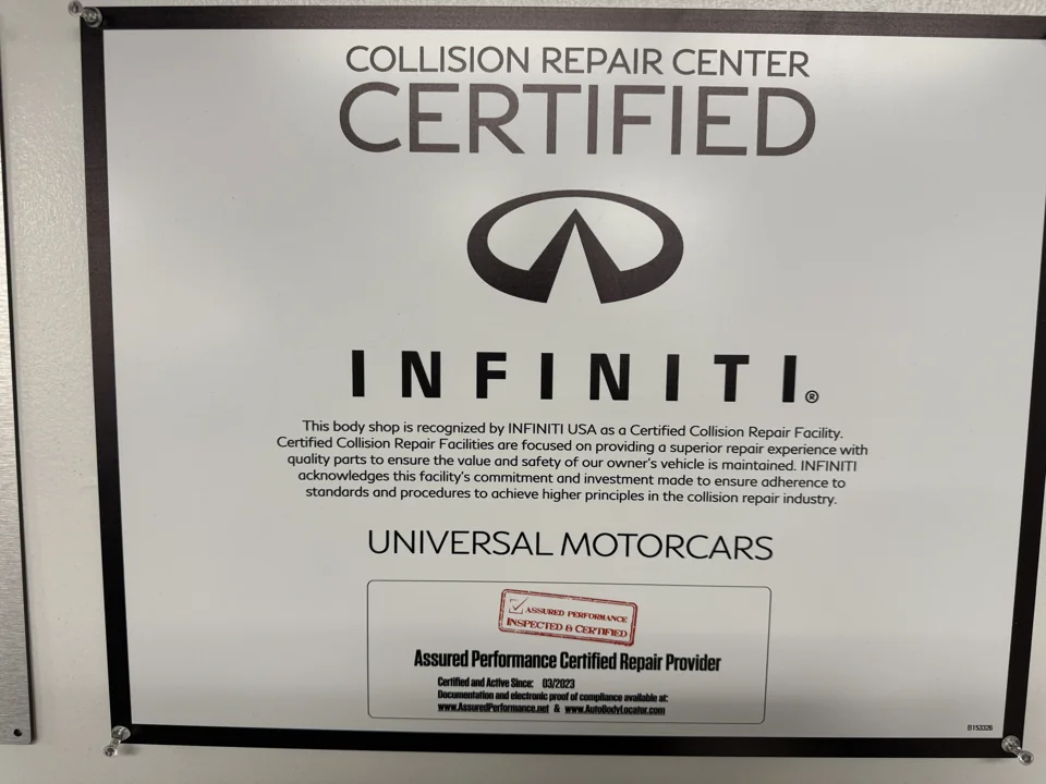 INFINITI collision repair certification plaque naming Universal Motorcars.