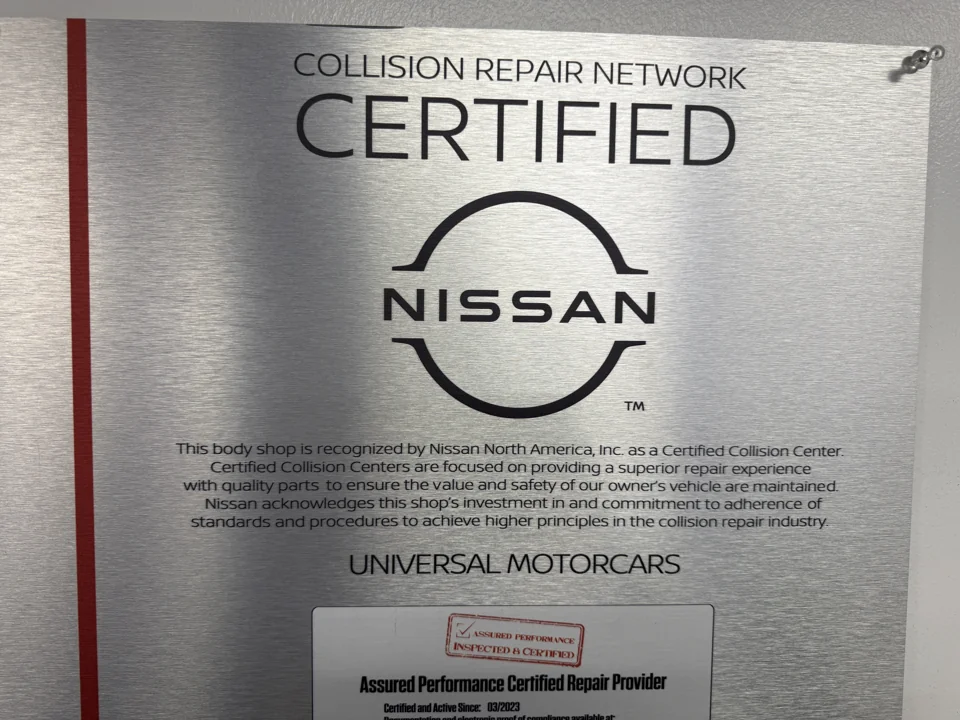 Nissan certification plaque naming Universal Motorcars.