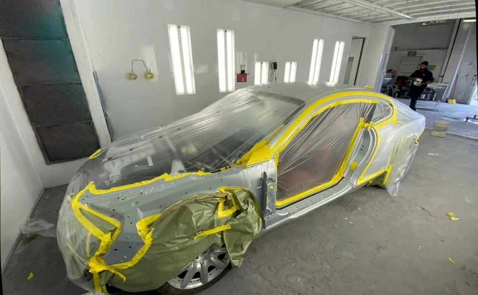 Bentley Continental GT masked and prepared in a paint booth