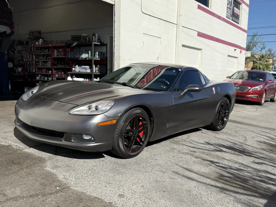 Gray Chevrolet Corvette C6 outside the Universal Motorcars workshop