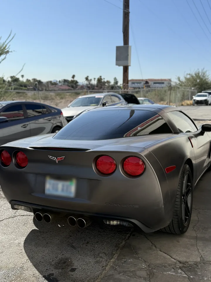 Gray Chevrolet Corvette C6, rear three-quarter view