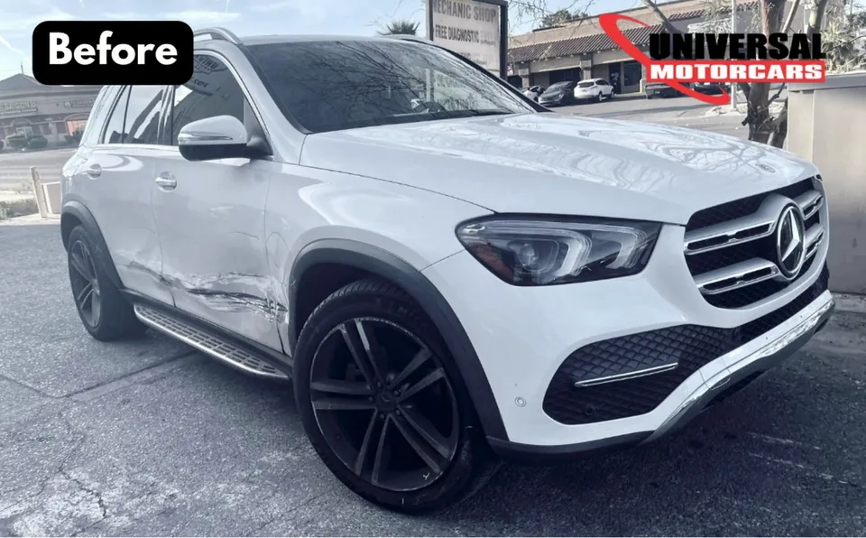 White Mercedes-Benz GLE with damage along its passenger-side doors