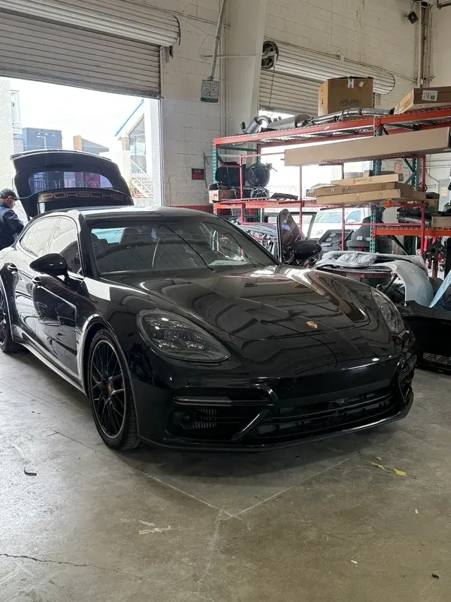 Black Porsche Panamera in the Universal Motorcars workshop