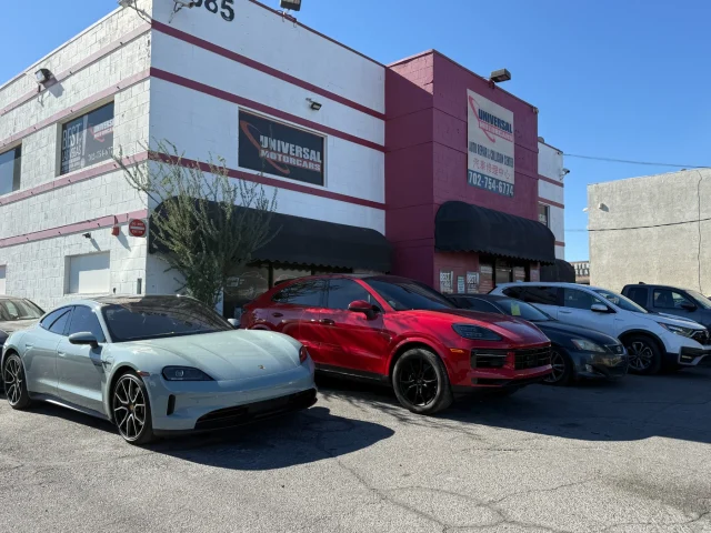 Porsche Taycan and Cayenne outside Universal Motorcars