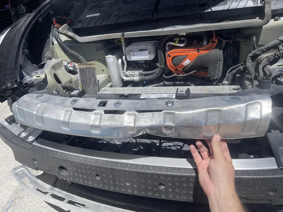 Close view of the Tesla front impact structure during disassembly