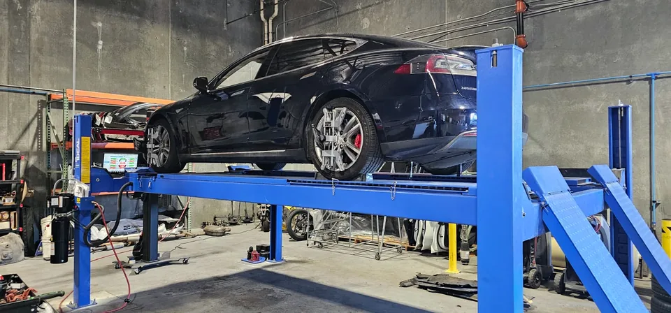 Rear view of the Tesla Model S on the alignment rack