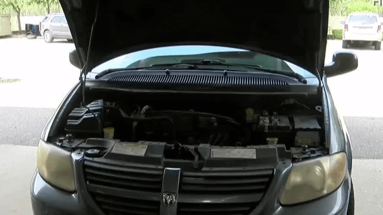 Open-hood vehicle pictured in News 3’s summer car-care report