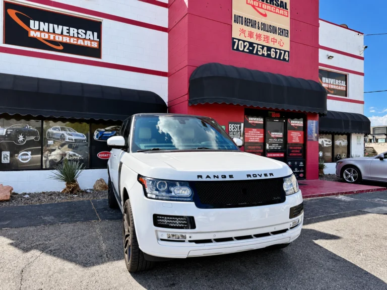 White Range Rover and the Universal Motorcars shop exterior.